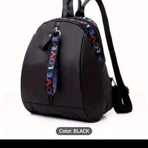 Black backpack with LOVE zipper pulls